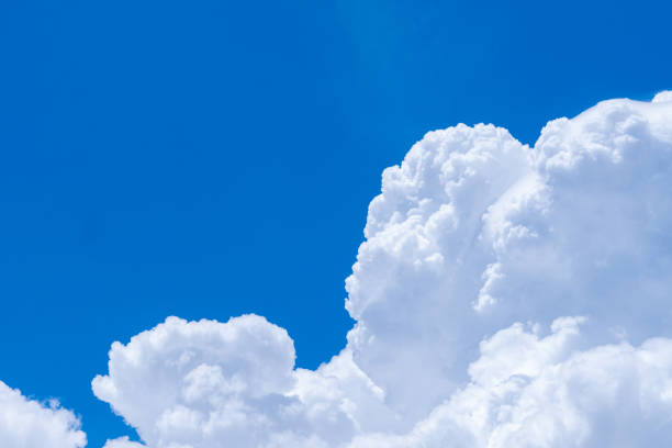 istock White fluffy clouds on blue sky. Soft touch feeling like cotton. White puffy cloudscape with space for text. Beauty in nature. Close-up white cumulus clouds texture background. Sky on sunny day. 1317562386