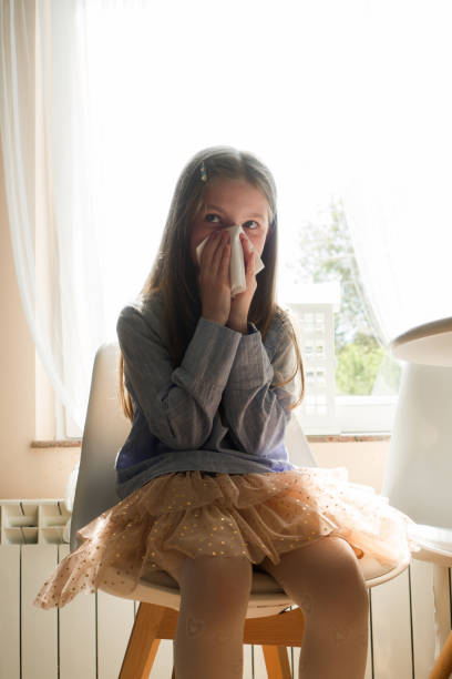 istock Little girl Sneezing 1317566750
