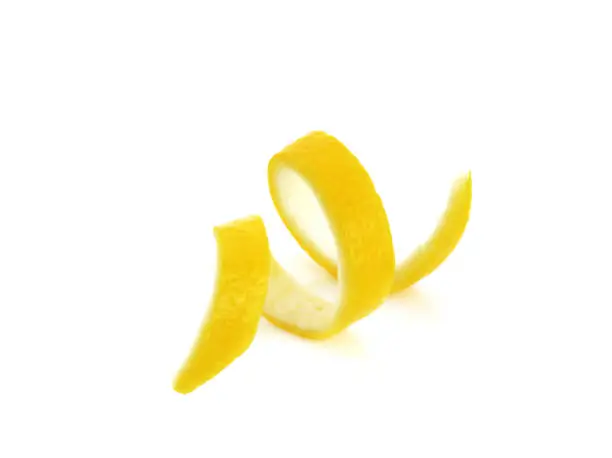 Photo of Lemon peel twist isolated on a white