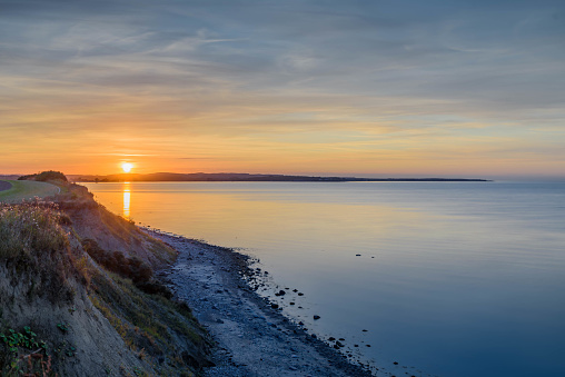 Panorama view of sunset on the steep coast of the Baltic Sea.Panorama of wild romantic coastal cliff landscape at the Baltic Sea at the Wangels, by Hohwacht Bay, Ostholstein, Schleswig-Holstein.