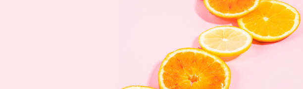 istock Colorful orange citrus slice fruit texture background on pastel pink 1317568957