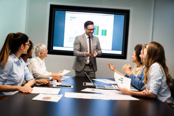 istock Group of business partners discussing documents and ideas at meeting 1317570086