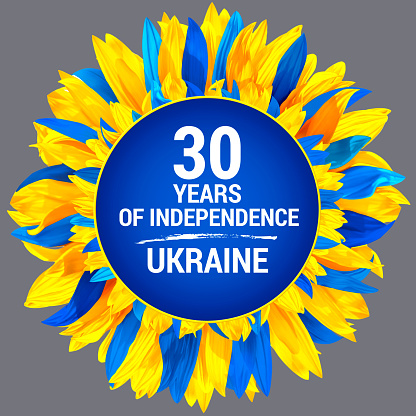 Circle frame, decorated with sunflower petals in colors of Ukraine flag. Ukraine Independence Day. Wreath made of blue and yellow sunflower petals