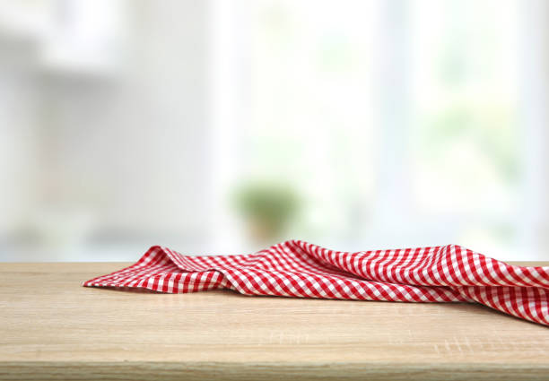 istock Empty table decorated with red checkered towel food advertisement display. Tabletop with empty space. 1317572192