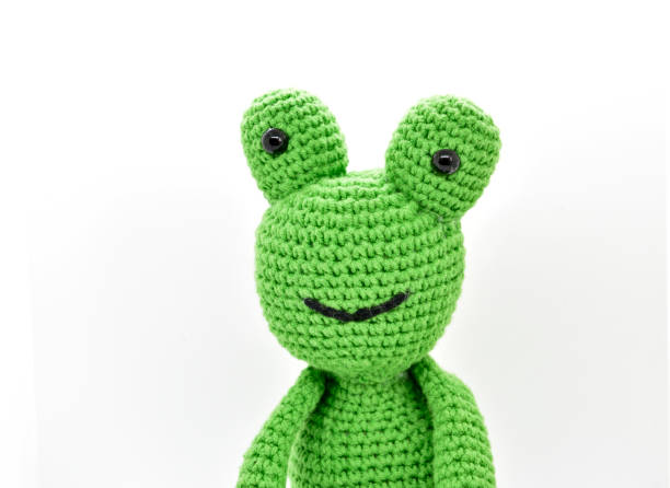 istock Cute green knitting frog 1317573011