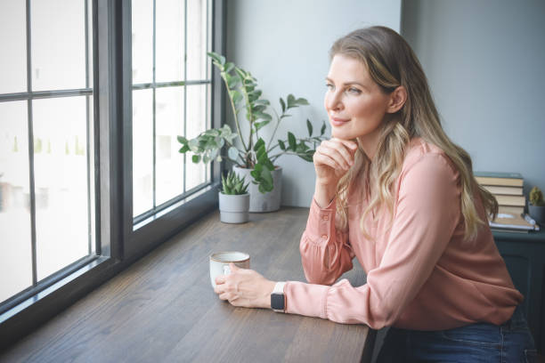 istock attractive middle aged woman in the office 1317575163