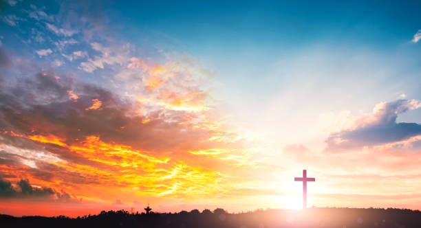 istock Religious day concept: Silhouette cross on  mountain sunset background 1317575816