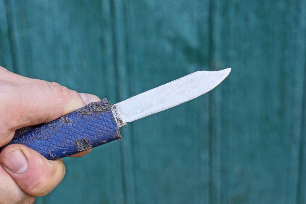istock hand holds an old knife with a white blade 1317579539