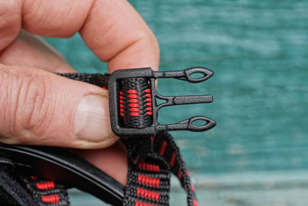 istock hand holds a plastic open carabiner latch 1317580084