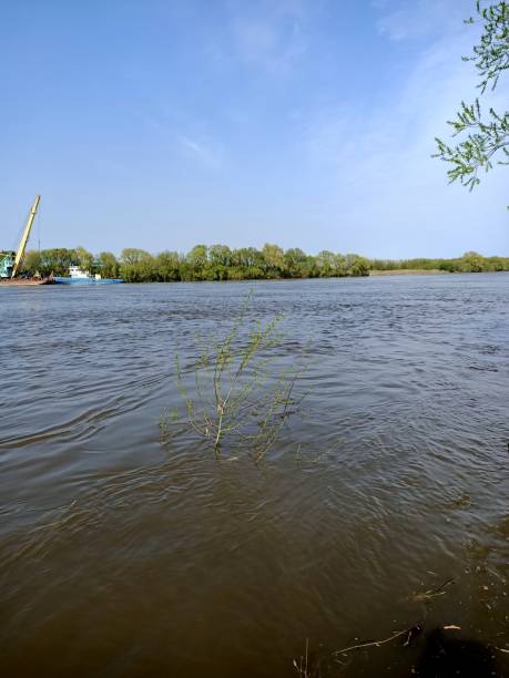 istock River under blue sky in green fields and hills 1317580146