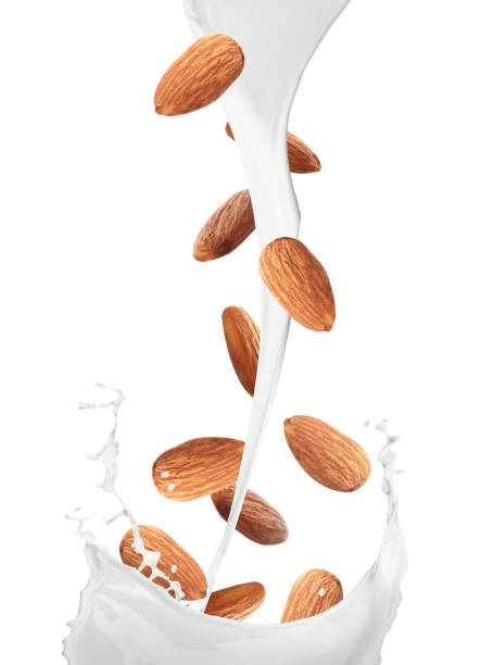istock Delicious almond milk and nuts on white background 1317580591