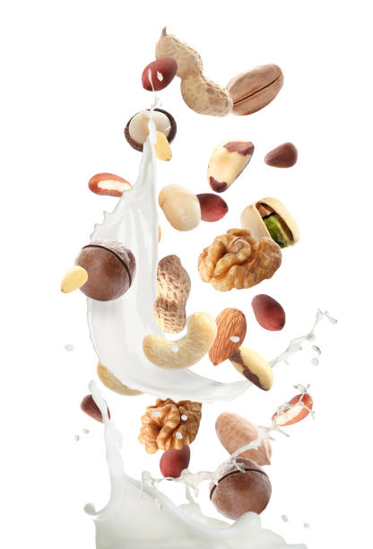 istock Delicious natural nut milk on white background 1317580593