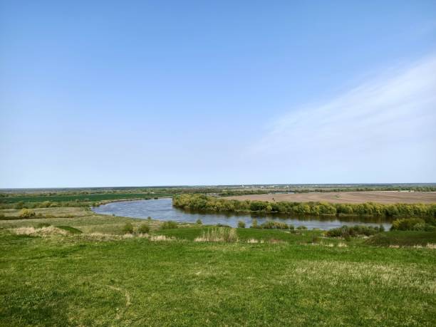 istock River under blue sky in green fields and hills 1317580869
