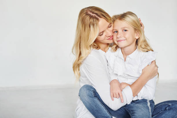 istock Mother with her daughter have fun together in the studio with white background 1317581641