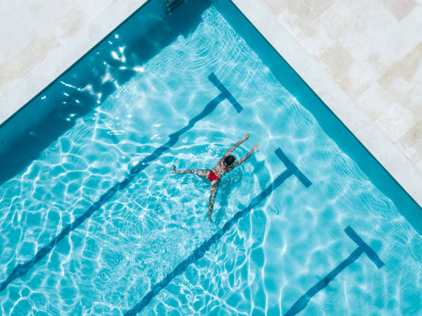istock overhead view on woman in red bikini in swimming pool 1317581721