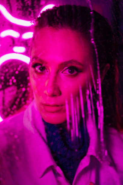 istock Woman Looking Throughout Wet Window at Camera 1317581779