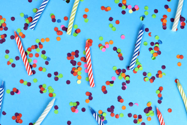 istock Colorful birthday candles on a blue background. Celebration party. Background, texture 1317582563