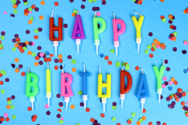 istock Colorful happy birthday candles on a blue background 1317582567