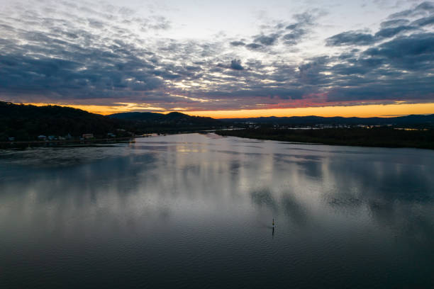 istock Sunrise aerial waterscape with clouds 1317583560