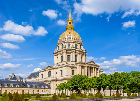 The Dome des Invalides in Paris, France, with its golden cupola, a former church which houses the tomb of Napoleon Bonaparte, and the southwest garden.