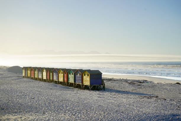 istock Bright beach changing rooms at Muizenberg, Cape Town 1317586920