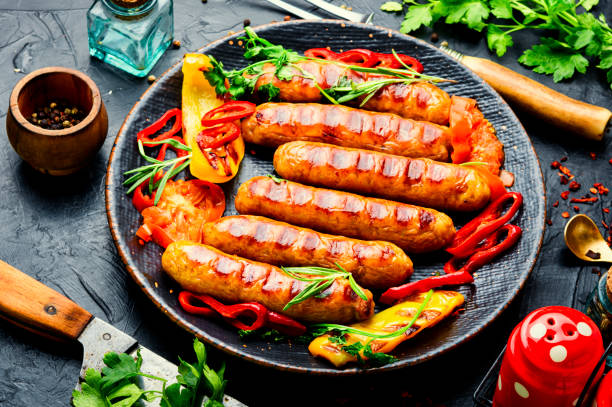istock Fried sausages and vegetables 1317588203