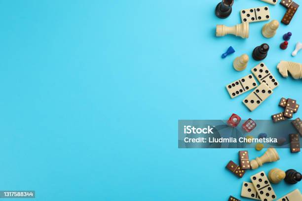 Components Of Board Games On Light Blue Background Flat Lay Space For Text Stock Photo - Download Image Now