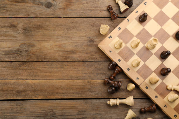 istock Flat lay composition of chess on wooden table, space for text. Board game 1317588451