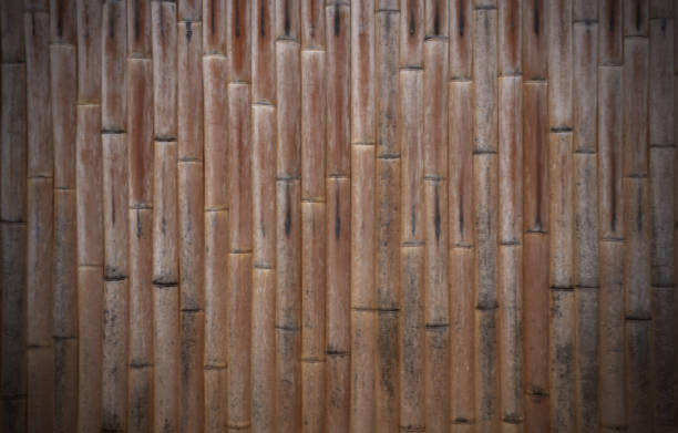 istock Brow color Bamboo old wall with vertical line striped pattern abstract background 1317588764