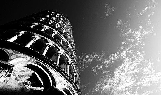 famous leaning tower of Pisa photographed from below with a breathtaking shot with black and white effect to highlight the architectural forms