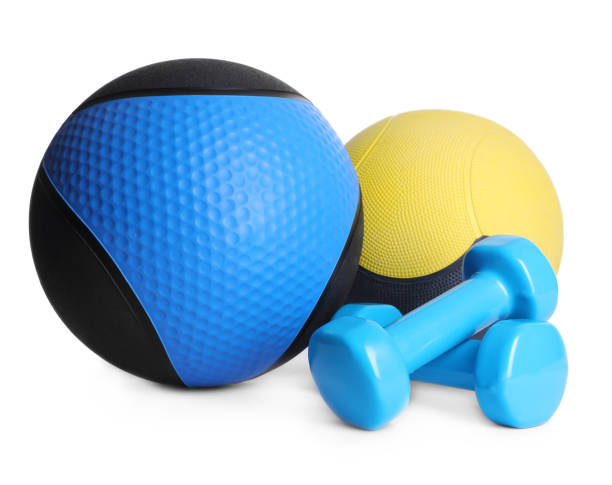 istock Medicine balls with dumbbells on white background 1317589523