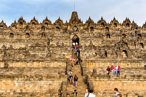 Ayutthaya, Thailand - August 26, 2023: tourists visiting the old Chaiwatthanaram temple complex.