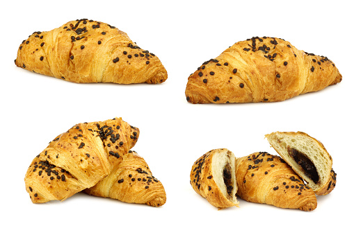 chocolate sprinkled and filled fresh croissants on a white background