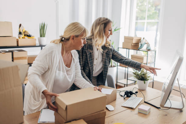 istock Women packing customers orders for drop shipping 1317596308
