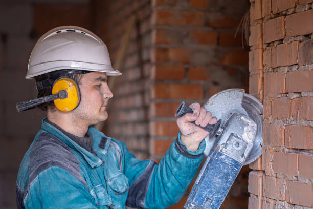 istock Handyman at a construction site in the process of cutting with a grinder. 1317596346