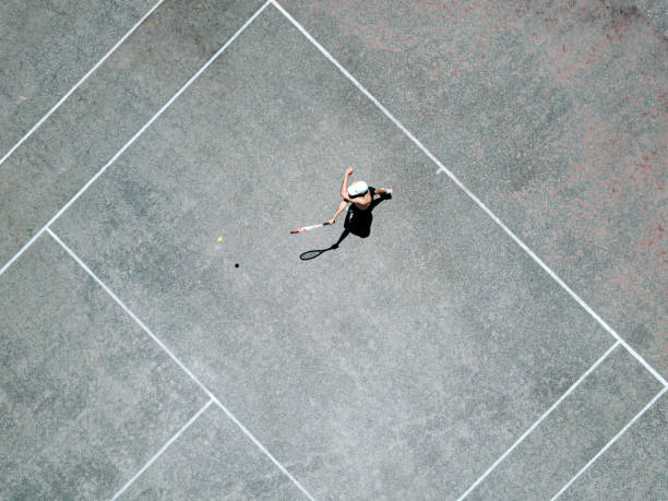 istock drone view over tennis player returning the ball 1317598960