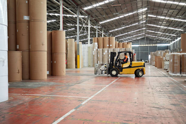 istock Caucasian Male Worker Driving Forklift in Warehouse 1317600244