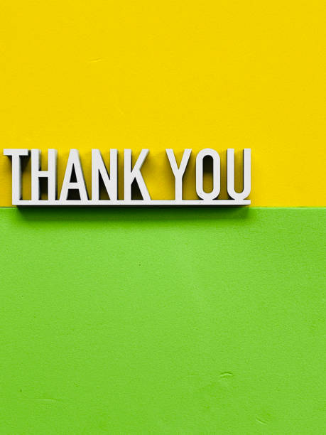 istock Thank you phrase on yellow green background 1317600576