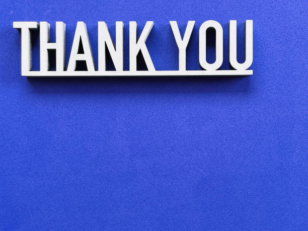istock Thank you phrase on blue background 1317601182