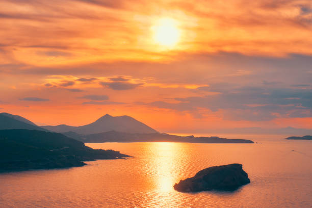 Aegean Sea with Greek islands view on sunset. Cape Sounion, Greece