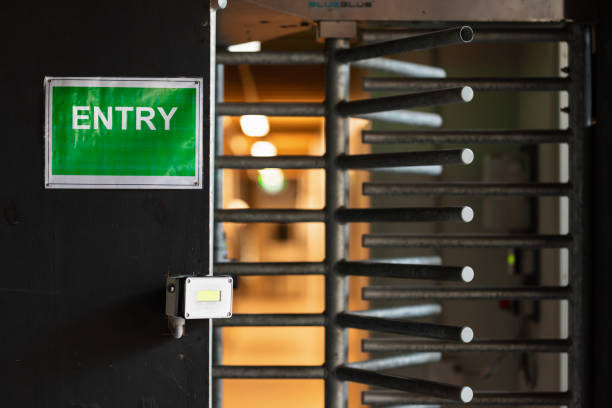 istock Metal turnstile with green entry sign 1317602754