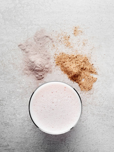 protein powder, chocolate and strawberry protein powder,protein shake with protein powder - protein concentrate imagens e fotografias de stock
