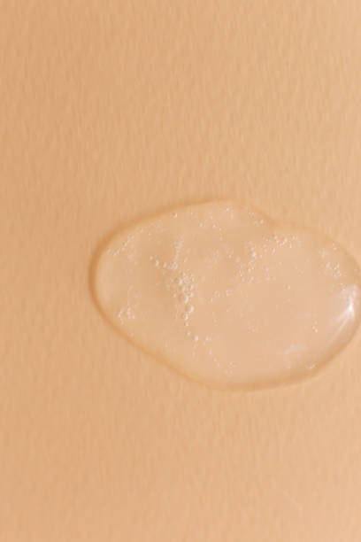 istock Cream gel transparent cosmetic sample texture isolated on beige background 1317605333