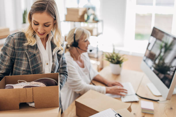 istock Women packing customers online orders 1317606847