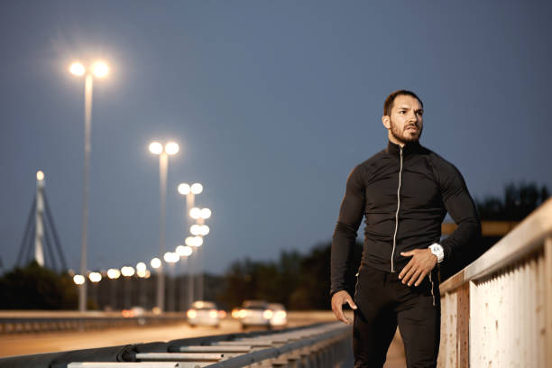 istock A young male athlete, preparing for training at dusk. 1317608608