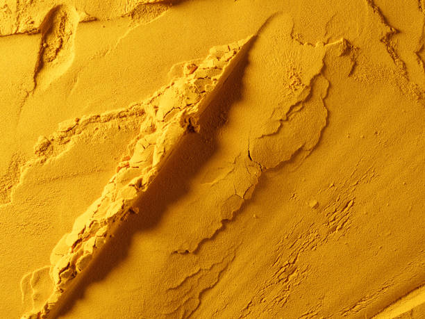istock Ground yellow powder made from dried turmeric root. 1317610010