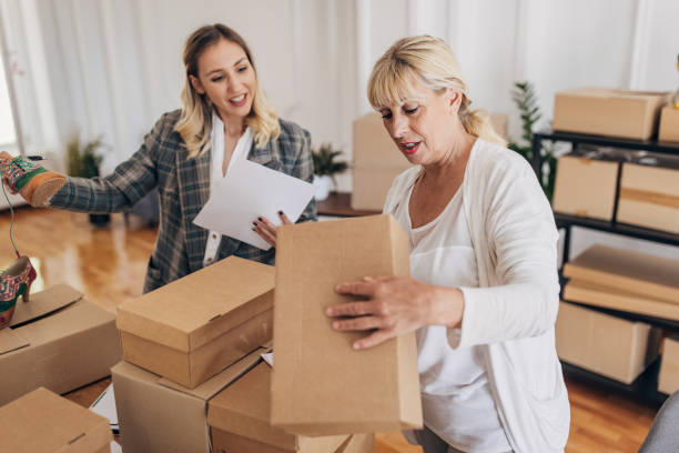 istock Women packing orders for drop shipping 1317610426