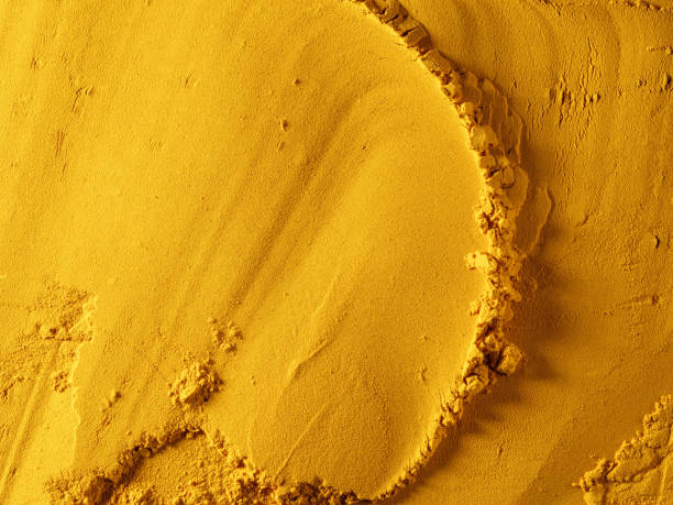 istock Ground yellow powder made from dried turmeric root. 1317610467