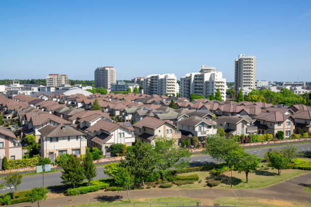 a residential area with lots of fresh greenery nearby. - tract houses imagens e fotografias de stock