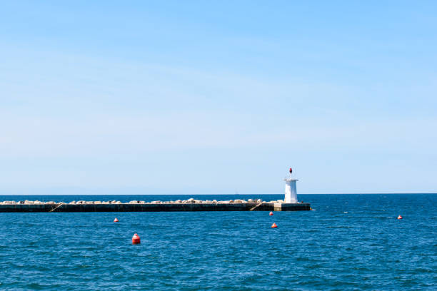 istock A lighthouse at the end of the pier 1317611785